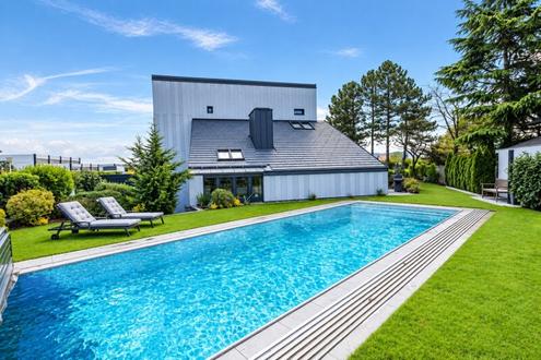 Blickfang mit Privatsphäre! Außergewöhnliches Designerhaus mit viel Raum zur Entfaltung | 9 Zimmer, Edelstahlpool, Sauna, Weinkeller | Vereint Wohnen und Arbeiten | Barrierefrei