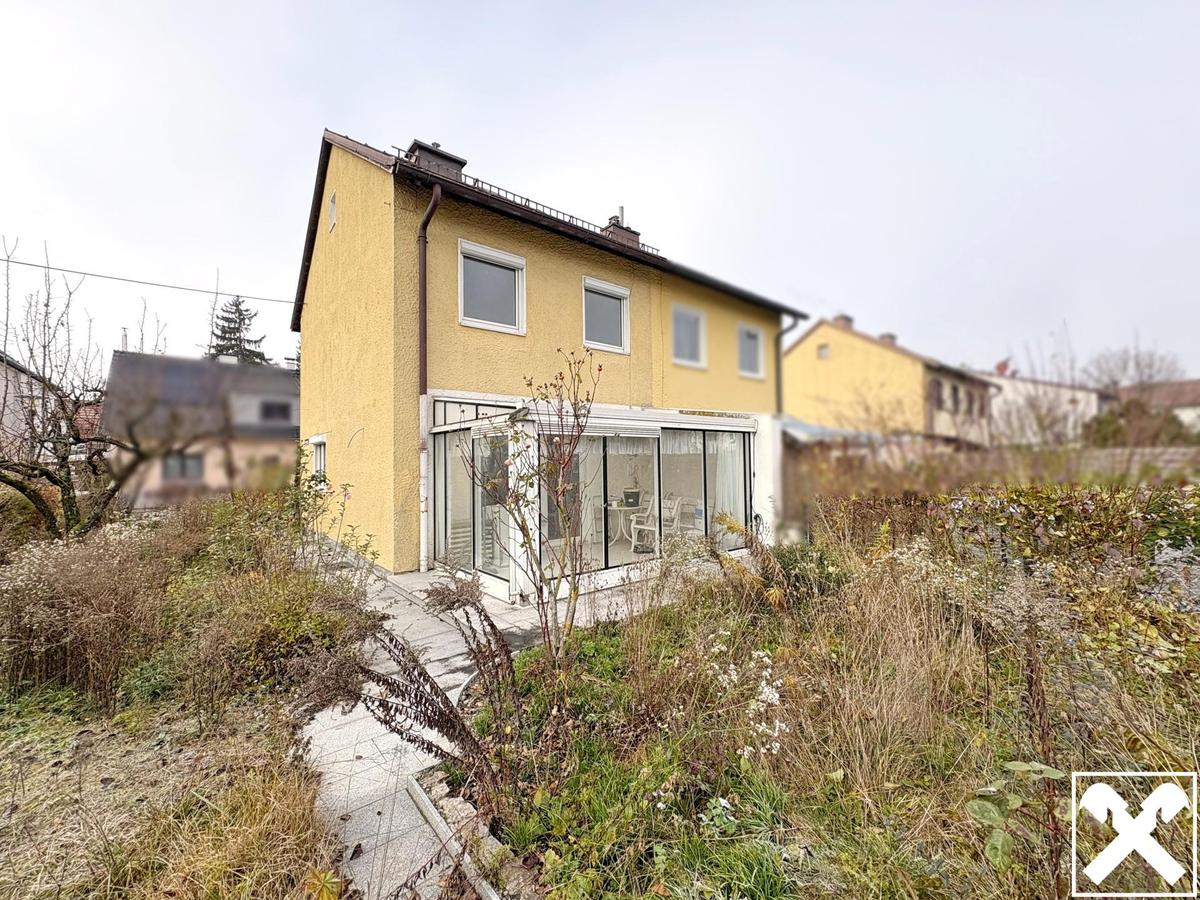 Hausr�ckseite mit Wintergarten