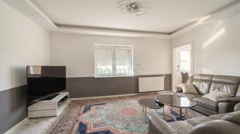 Ideale Investition mit 8% Rendite: Zweifamilienhaus mit Geschäftslokal in zentraler Lage